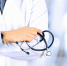 Portrait an unknown male doctor holding a stethoscope behind - News102.Ru