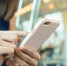Woman using cellphone inside train compartment - News102.Ru