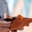 putting-sunglasses-into-a-yellow-leather-case - News102.Ru