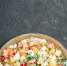 top-close-view-of-bowl-of-vegetable-salad-on-the-bottom-side-with-green-on-it-on-dark-green-background - News102.Ru