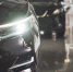 the-headlights-and-the-hood-of-a-black-luxury-car - News102.Ru