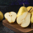 wooden-board-of-delicious-yellow-pears-on-black-surface - News102.Ru