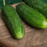 fresh-ripe-cucumbers-on-wooden-board (1) - News102.Ru