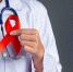 the-doctor-holds-a-red-ribbon-hiv-awareness-awareness-world-aids-day-and-world-sexual-health-day - News102.Ru