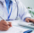 hands-of-unrecognizable-female-doctor-writing-on-form-and-typing-on-laptop-keyboard - News102.Ru