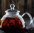 black-tea-with-dry-tea-in-a-teapot-on-wooden-surface-side-view - News102.Ru