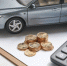 car-model-calculator-and-coins-on-white-table - News102.Ru
