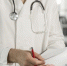 doctor-with-medical-mask-checking-his-notes - News102.Ru