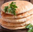 close-up-pita-bread-wooden-board_318269-166 - News102.Ru