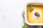 cottage-cheese-baked-pudding-with-natural-yogurt-sour-cream-red-berry-jam-mint_132278-1865
