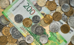 money-coins-and-banknotes-in-russian-rubles-scattered-in-a-heap-on-the-table-top-view-idea-for-background-or-banner-for-market-news